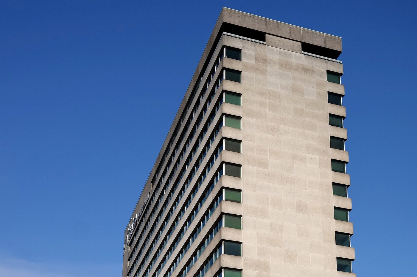 The Tinbergen tower on Campus Woudestein under a clear sky